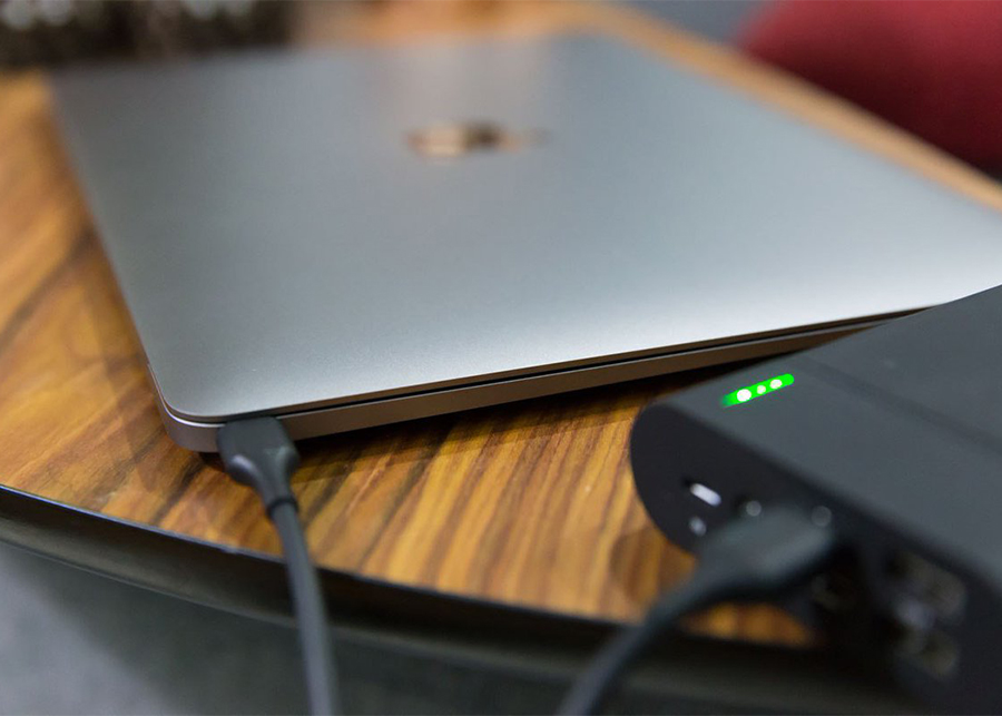 How do I charge my laptop with my phone?